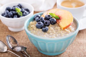 Breakfast quinoa porridge with fresh fruits in a bowl